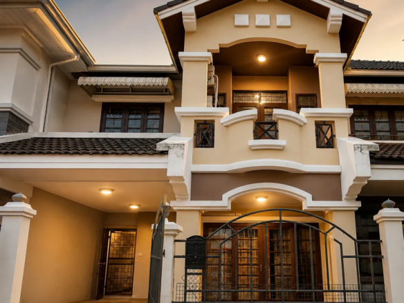 Front exterior of a luxury 2-storey townhouse with covered parking, elegant façade, and warm evening lighting, move-in ready home in Thailand.