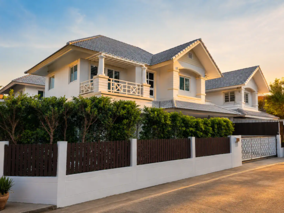 Two-storey detached house with a private garden at Baan Suan Racha, Ramintra, available for sale and rent near public transportation.